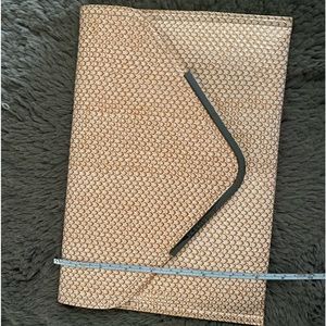 Preloved BCBGeneration coral / copper /rust colored reptile print clutch purse.